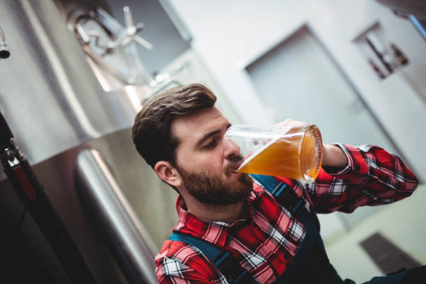 istock Manufacturer drinking beer at brewery 651240702
