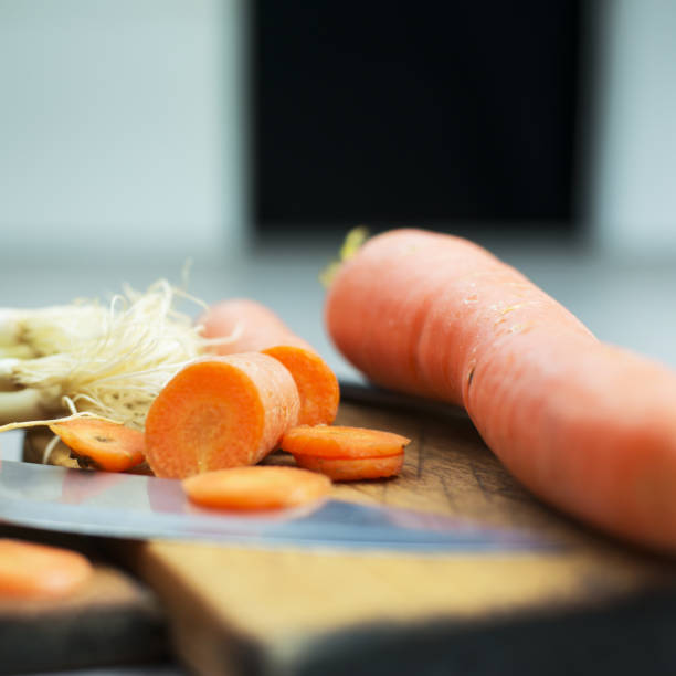Various vegetables Various vegetables, caroot and spring onion on cutting board on old wooden desk knif stock pictures, royalty-free photos & images