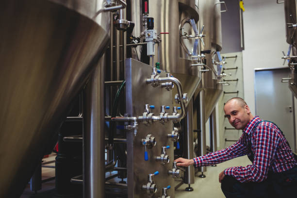 istock Brewery manufacturer adjusting pressure gauge 651244112