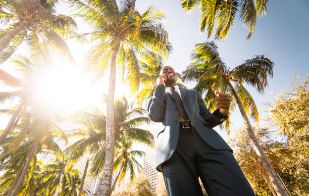 istock businessman walking on the beach in Miami 651247996