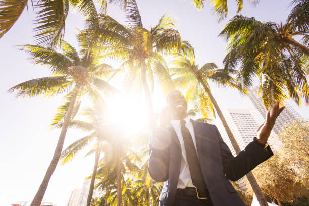 istock businessman walking on the beach in Miami 651248048