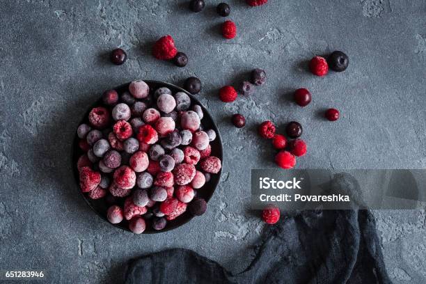 Frozen Raspberry Blueberry Cranberry On Dark Background Stock Photo - Download Image Now