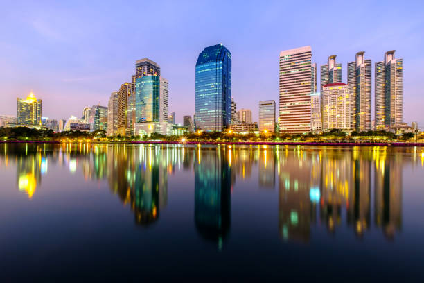 istock City downtown at night with reflection of skyline 651304846