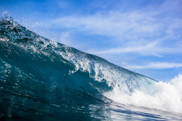 istock Beautiful crystal wave in ocean. Clear wave and sun light 651307258