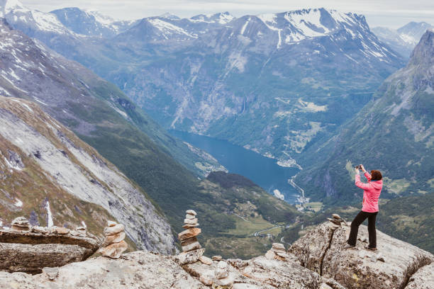 istock Tourist taking photo from Dalsnibba viewpoint Norway 651312800