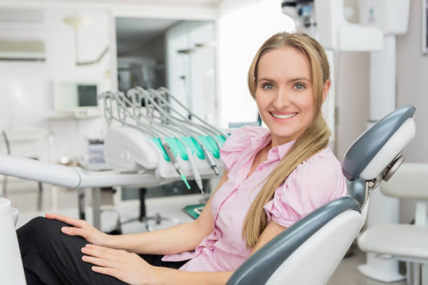 istock Smiling blond-haired woman on dental exam 651319146