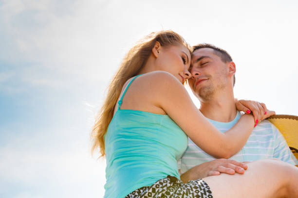 istock Man and woman sitting together outside 651322048