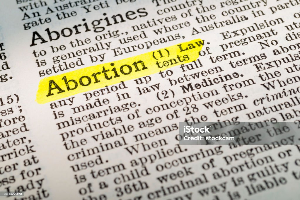Abortion - dictionary definition highlighted The term Abortion - dictionary definition highlighted with yellow marker Abortion Stock Photo