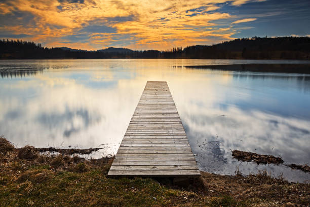 istock Wooden pier stretching into the lake 651324500