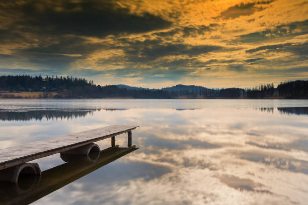 istock Wooden pier stretching into the lake 651324506