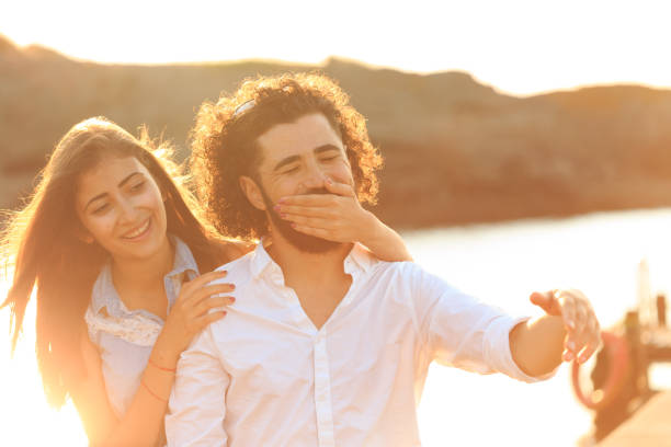 istock Young couple having fun on pier 651330278