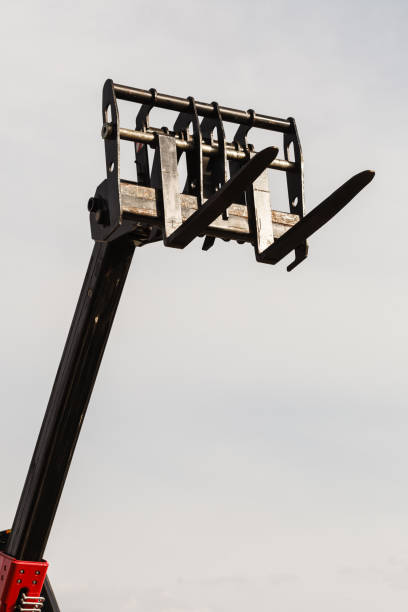 istock Bucket lift with blue sky in background 651330494