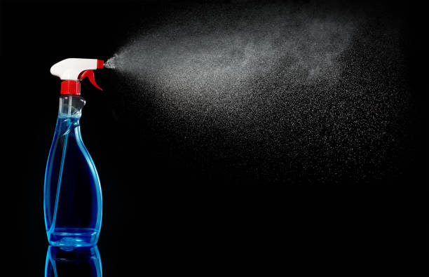 istock sprinkler spraying liquid on black background 651335248