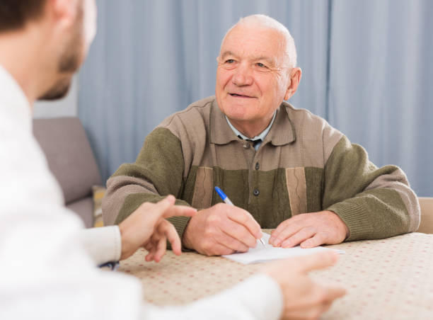 istock Man signing papers at home 651337902