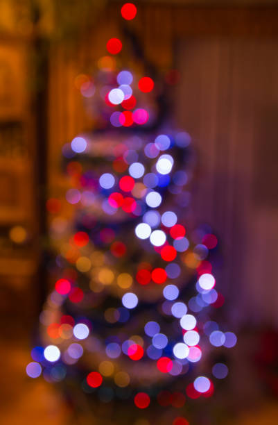 istock Blurred view of a lights on christmas tree 651338968