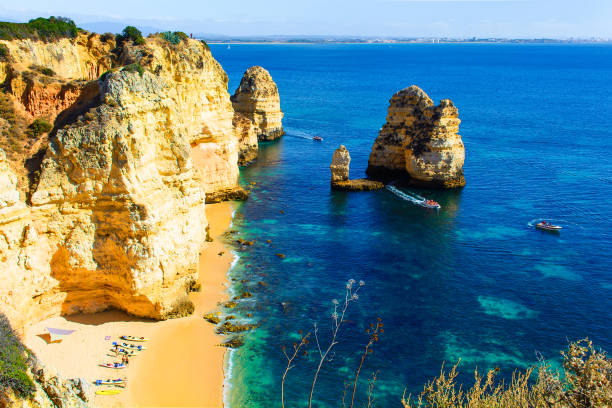 istock beautiful hidden sandy beach between rocks with kayaks 651341730