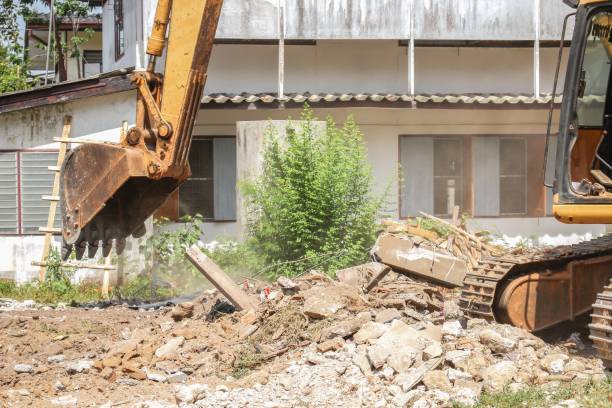 istock Excavator, bulldozer in work demolition construction and dust motion 651341758