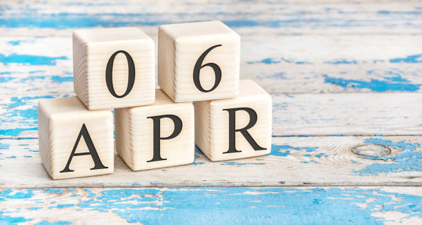 April 6th. Wooden cubes with date of 6 April  on old blue wooden background. April 6th. Wooden cubes with date of 6 April  on old blue wooden background. day 6 stock pictures, royalty-free photos & images