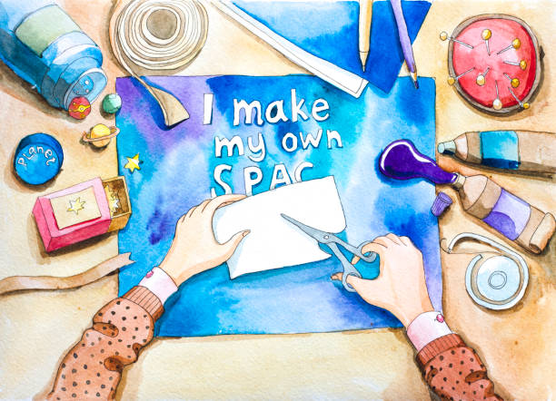 istock watercolor illustration.top view of work table and hands. Hand made scrapbooking card. I make my own space 651345548
