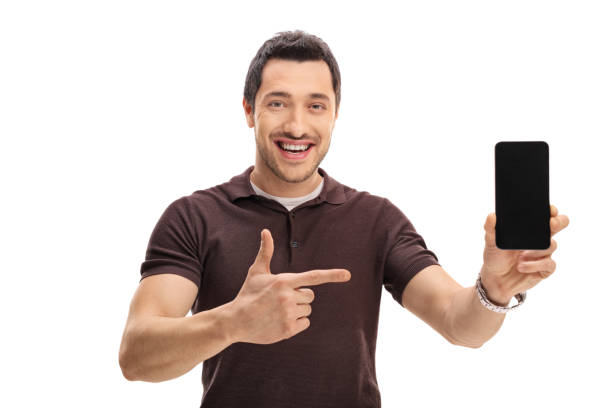 istock Happy man showing a phone and pointing 651349126