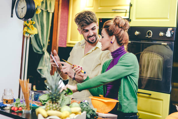 Man and woman preparing dinner