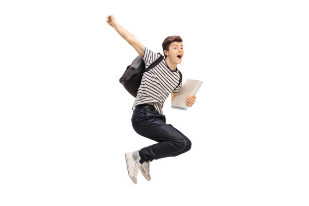 istock Overjoyed teenage student jumping and gesturing happiness 651351914