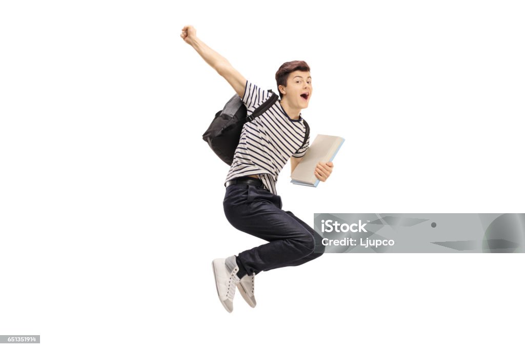 Overjoyed teenage student jumping and gesturing happiness Overjoyed teenage student jumping and gesturing happiness isolated on white background Jumping Stock Photo