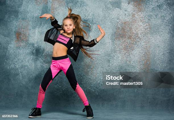 Young Girl Break Dancing On Wall Background Stock Photo - Download Image Now - Dancing, Girls, Child