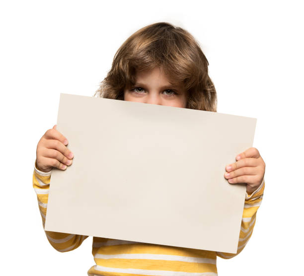 istock Cute little boy holding advertising banner 651352452