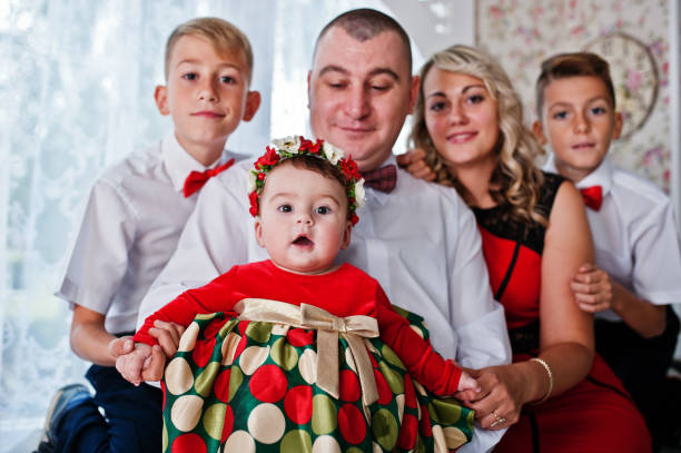 istock Caucasian family posed in vintage studio room 651353852