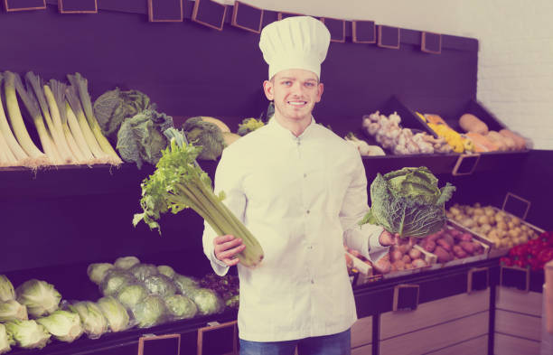 istock Male chef looking for fresh vegetables 651354364