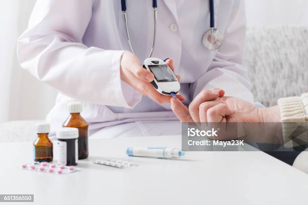 Measuring Blood Sugar Stock Photo - Download Image Now - Diabetes, Doctor, Medicine