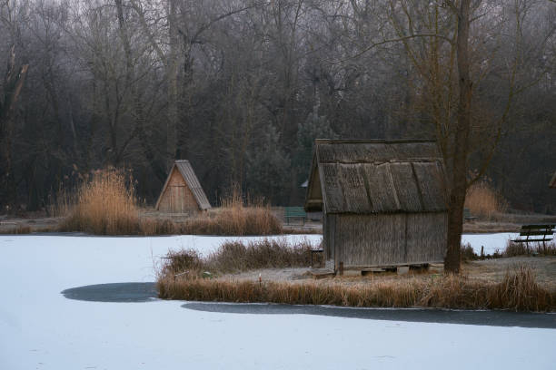 istock Fishing huts on winter lake 651361142