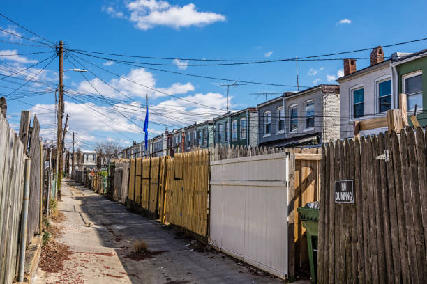 A narrow old road between rows of homes in the historic Northern Baltimore neighborhood of Hampden.