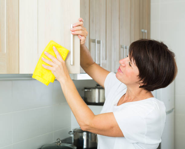 istock mature woman cleaning 651389250