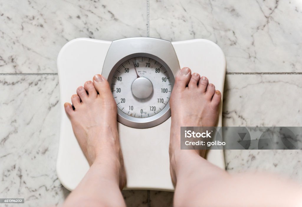 https://media.istockphoto.com/id/651396232/photo/a-person-is-standing-on-a-weight-scale-or-scales-to-check-the-body-weight.jpg?s=1024x1024&w=is&k=20&c=syqW3lm13SOqyvXvvRjhzFNmk-8nAV8ARw-QnpK4eas=