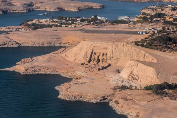 Aerial view of Abu Simbel, Nubia, Egypt. Abu Simbel are two rock temples situated on the bank of Lake Nasser in Nubia, Egypt. The temples were originally carved in the 13th century BC, as a lasting monument to Pharaoh Ramesses II and his queen Nefertari. This is a Unesco World Heritage Site. rameses ii stock pictures, royalty-free photos & images