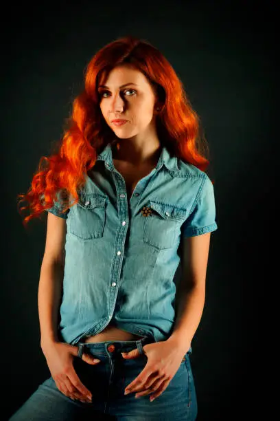 Young woman with long red hair