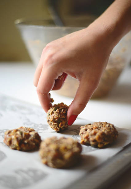 istock Woman hands making healthy biscuits  - Home made holliday cookies preparation set 651446988