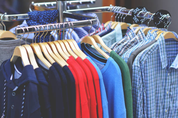 istock Clothes on hangers in shop 651449338