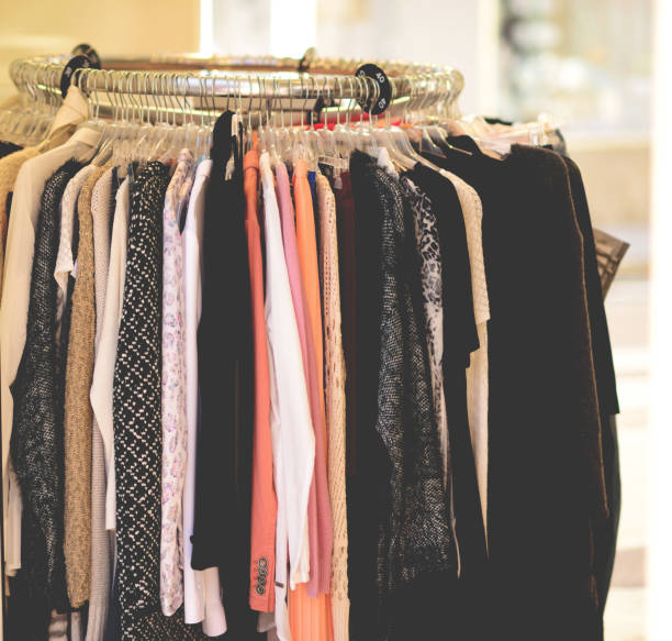 istock Clothes on hangers in shop 651449358