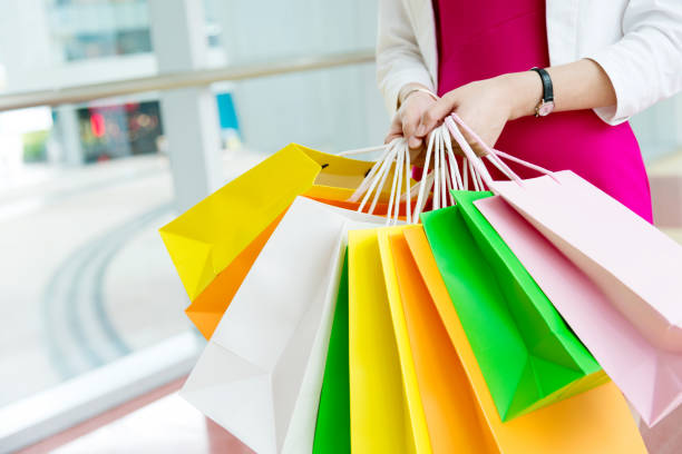 istock Woman holding shopping bags 651462630