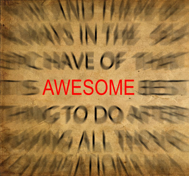 istock Blured text on vintage paper with focus on AWESOME 651464444
