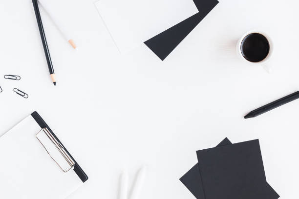 istock Stylish workspace with notebook, cup of coffee, paper blank, pencils 651470080