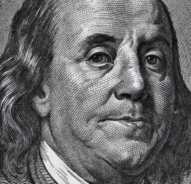 istock Extreme macro of 100 dollar bill with Benjamin Franklin portrait 651470426