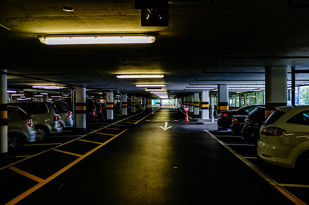 istock Empty Driveway Of Illuminated Parking Lot 651478011