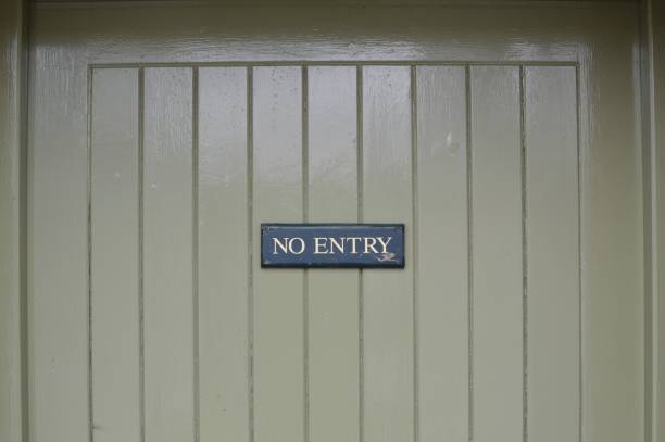 istock No entry sign on wood door. 651479562