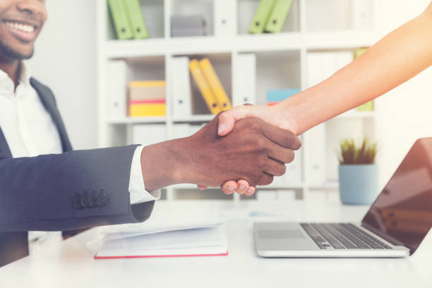 istock Man and woman shaking hands in the office 651480048