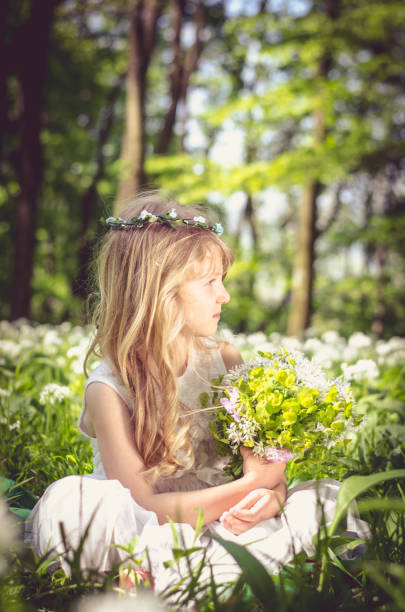 istock lovely blond girl in spring forest 651484990