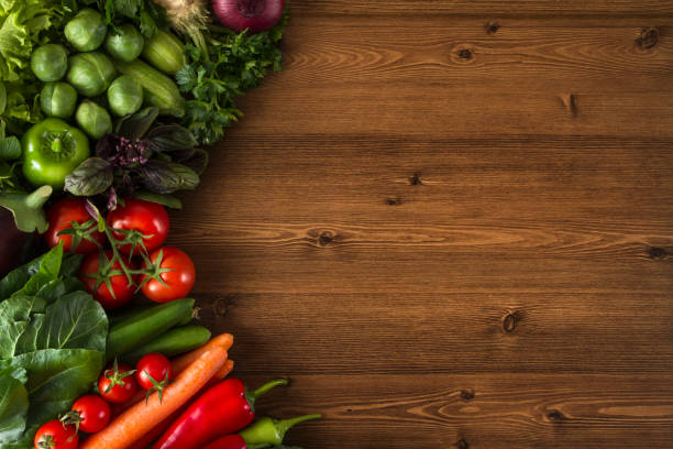 istock Fresh Vegetables on Brown Wooden Background 651486490